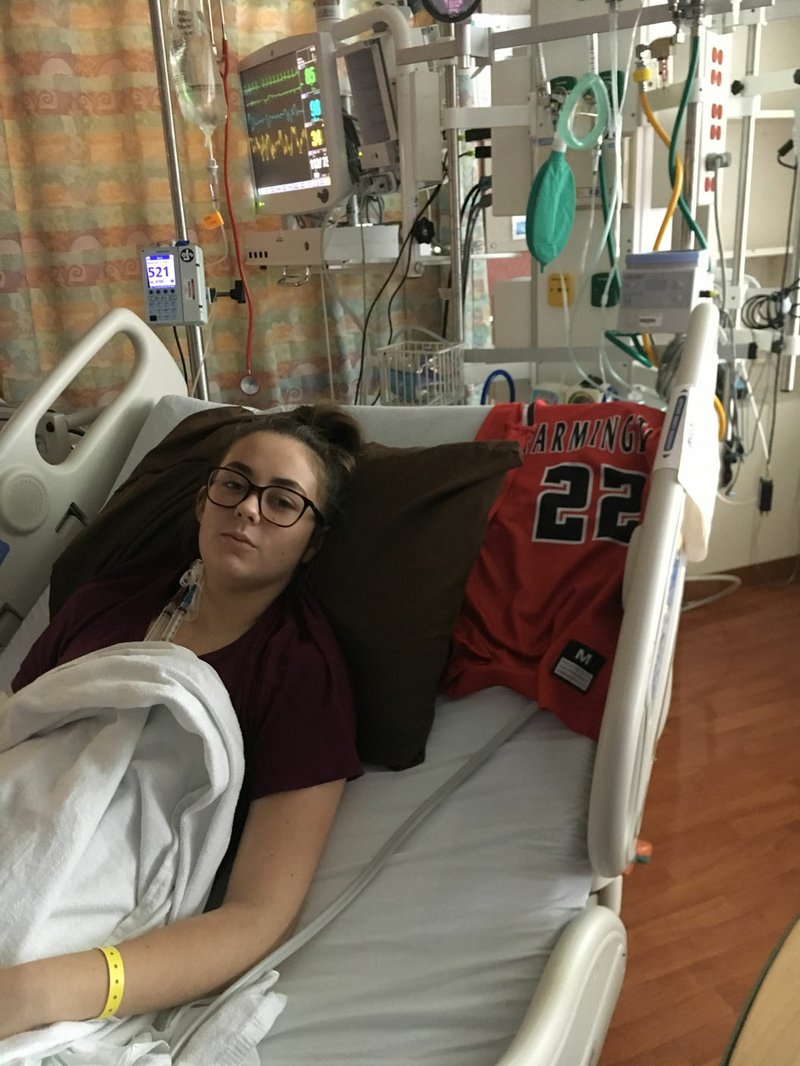Makenna Vanzant was presented her No. 22 Farmington uniform top by Lady Cardinals coach Brad Johnson while she was being treated for Hemolytic Uremic Syndrome at the Arkansas Children’s Hospital in Little Rock.