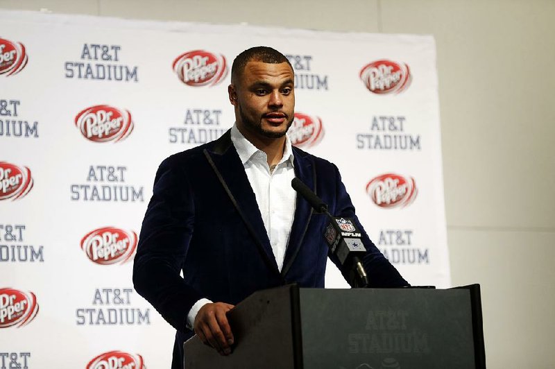 Dallas Cowboys quarterback Dak Prescott responds to a reporters question during a news conference after an NFL football game against the Seattle Seahawks on Sunday, Dec. 24, 2017, in Arlington, Texas. 