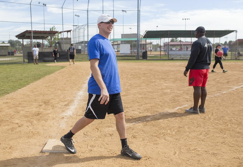 NWA Democrat-Gazette File PHoto/CHARLIE KAIJO Ryan Monigan of Rogers gets ready to run to second base during a kickball tournament Sept. 29 at Memorial Park in Bentonville.