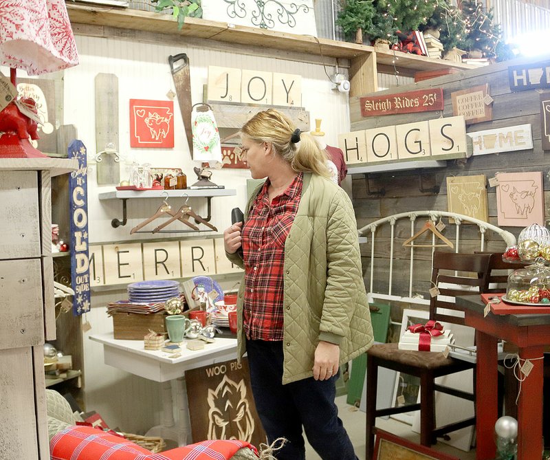 LYNN KUTTER ENTERPRISE-LEADER Bonnie Boyd of Siloam Springs shops at Daisies and Olives during its 20th anniversary open house on Dec. 9.