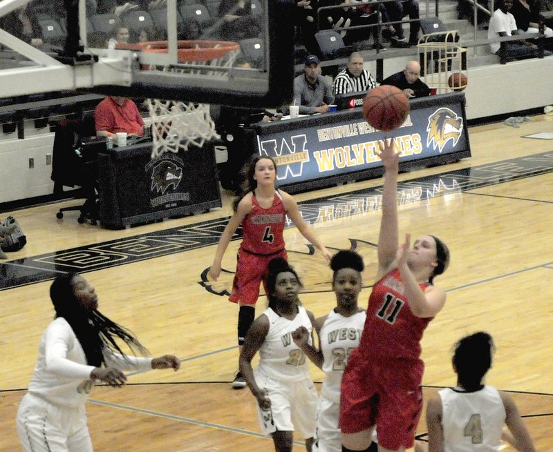 MARK HUMPHREY ENTERPRISE-LEADER Farmington senior Camryn Journagan aggressively goes to the basket against Bentonville West. The Lady Cardinals beat the 7A school, 58-51, with Journagan scoring 15 points on Dec. 19.
