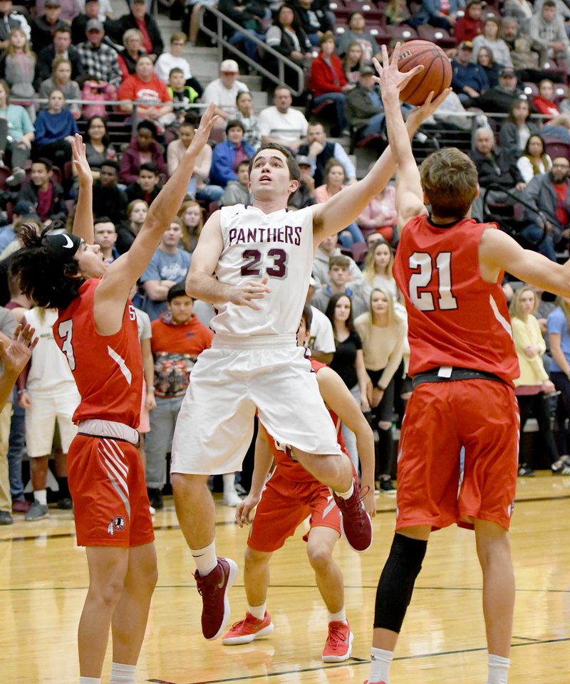 Bud Sullins/Special to the Herald-Leader Siloam Springs senior Spencer Lashley goes up for a shot in traffic against Stilwell, Okla., on Dec. 15. Lashley and the Panthers host Claremore, Okla., at 8:30 p.m. Thursday in the opening round of the Siloam Springs Holiday Classic.
