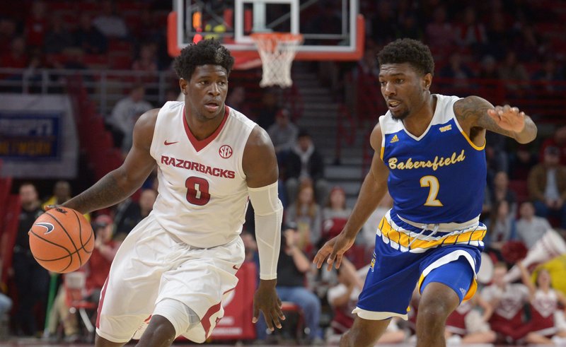 Arkansas guard Jaylen Barford drives past a California State University, Bakersfield defender in Bud Walton Arena on Dec. 27, 2017. 