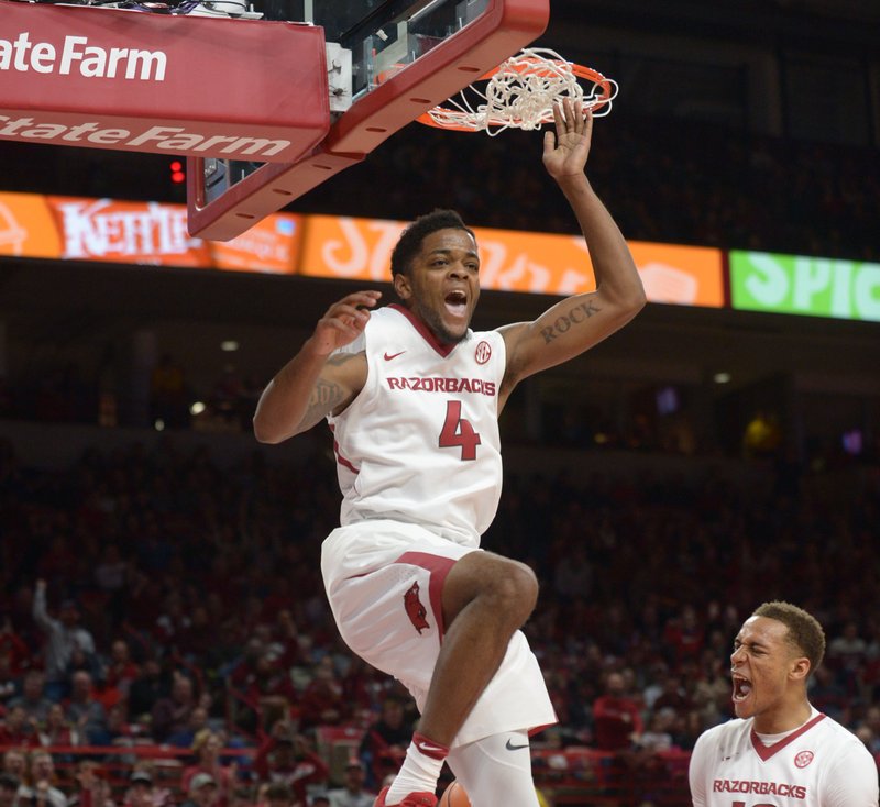 Arkansas guard Daryl Macon (left) celebrates a dunk against California State University, Bakersfield in Bud Walton Arena on Wednesday, Dec. 27, 2017. 