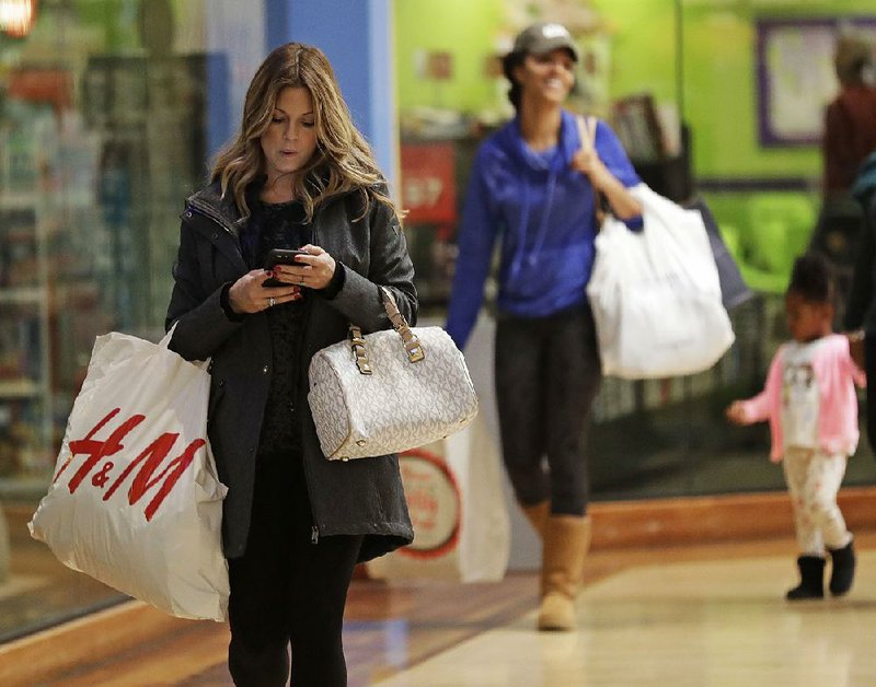 Christmas shoppers were out in force at Concord Mills Mall in Concord, N.C., last week. Despite a bit of a lapse in December, consumer confidence remains high, the Conference Board reported Wednesday. 