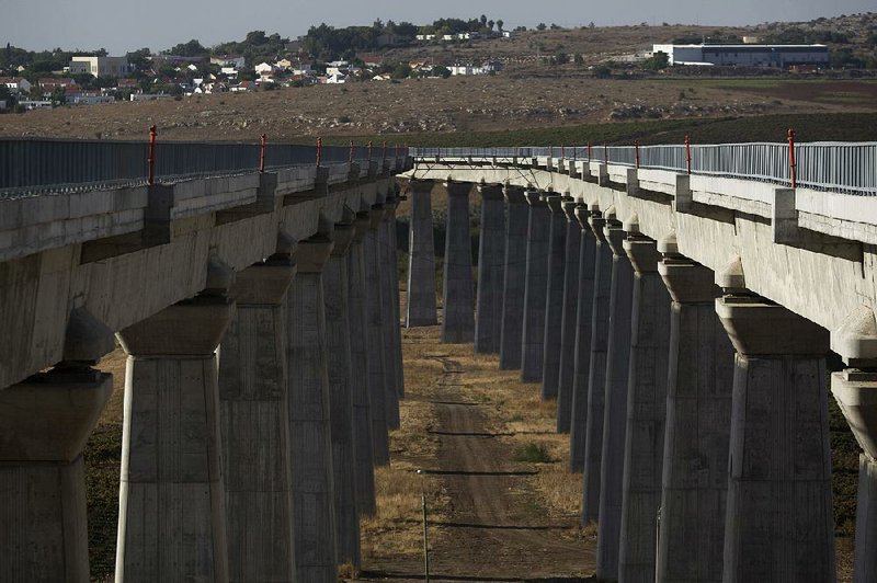 This file photo shows a bridge under construction that is part of Israel’s planned high-speed train line between Jerusalem and Tel Aviv. A Muslim cleric in Jerusalem has raised objections to naming a station on the line for President Donald Trump. 