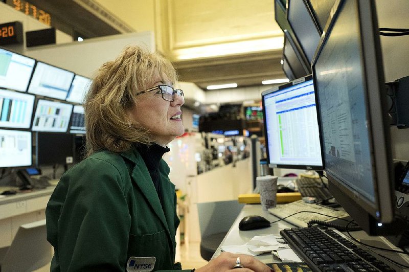 Maria Averna, a lead supervisor for New York Stock Exchange operations, monitors trading Wednesday. U.S. stock indexes closed slightly higher after losing ground Tuesday.