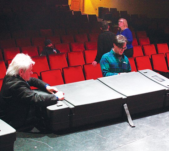 The Sentinel-Record/Grace Brown PREMIERE PREP: Maxwell Blade, left, and investor Brian Burrough pack up equipment on Wednesday in preparation for tonight's premiere of the Polish film "Loving Vincent" at the Malco Theatre.