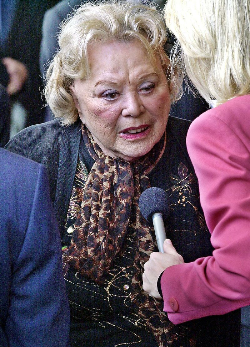 In this April 1, 2002, file photo, actress and comedian Rose Marie talks to the press as she arrives for a ceremony honoring comedian Milton Berle at Hillside Memorial Park and Mortuary in Los Angeles. 