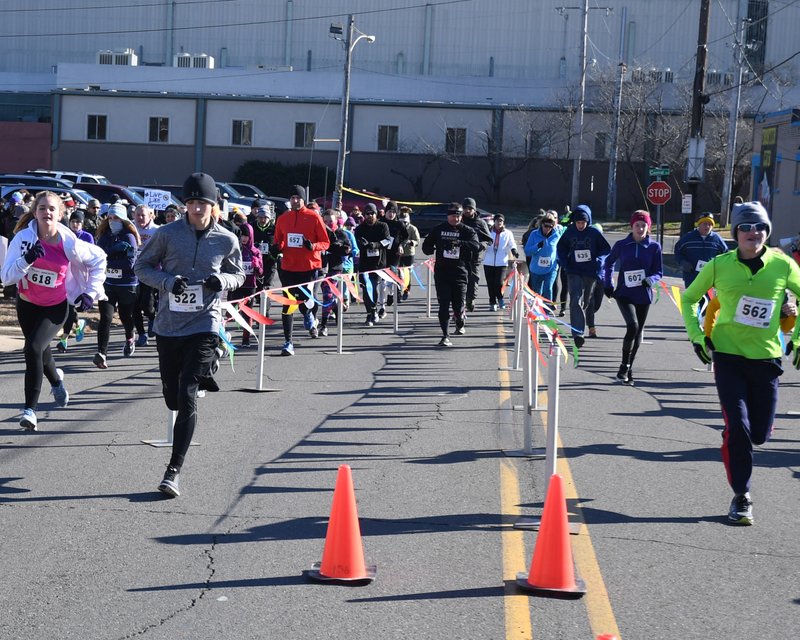 The Sentinel-Record/File photo AND THEY'RE OFF: Runners begin the second annual Jockey Jog on Jan. 7, 2017. The 5K, hosted by the Garland County Chapter of Circle of Friends, raises money each year for Arkansas Children's Hospital.