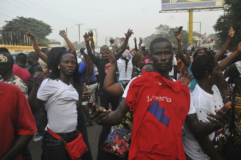 Supporters of former soccer player George Weah celebrate his election as president Friday in Monrovia, Liberia.
