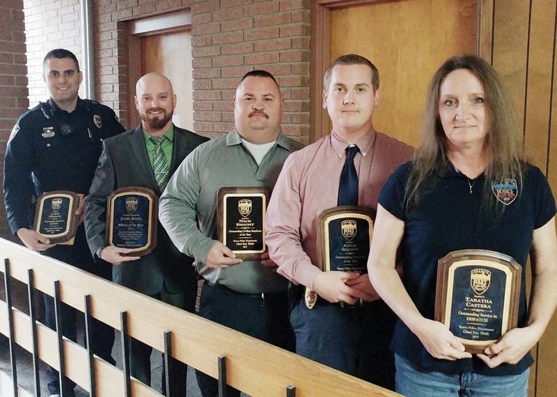 Five employees of the Searcy Police Department were honored with yearly awards during its Christmas party Dec. 15. They are, from left, Jason Denison, Patrol Officer of the Year; Josh King, Officer of the Year; Nick Bright, Outstanding Civilian Employee of the Year; Adam Sexton, Detective of the Year; and Tabatha Castera, Dispatcher of the Year.