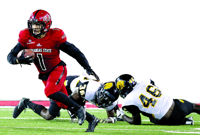 Photo showing the Arkansas Democrat-Gazette Sportsman of the year: Blaise Taylor (left)