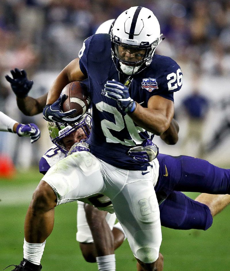 Penn State running back Saquon Barkley (26) rushed for 137 yards on 18 carries and 2 touchdowns in Penn State’s 35-28 victory over Washington in the Fiesta Bowl. 