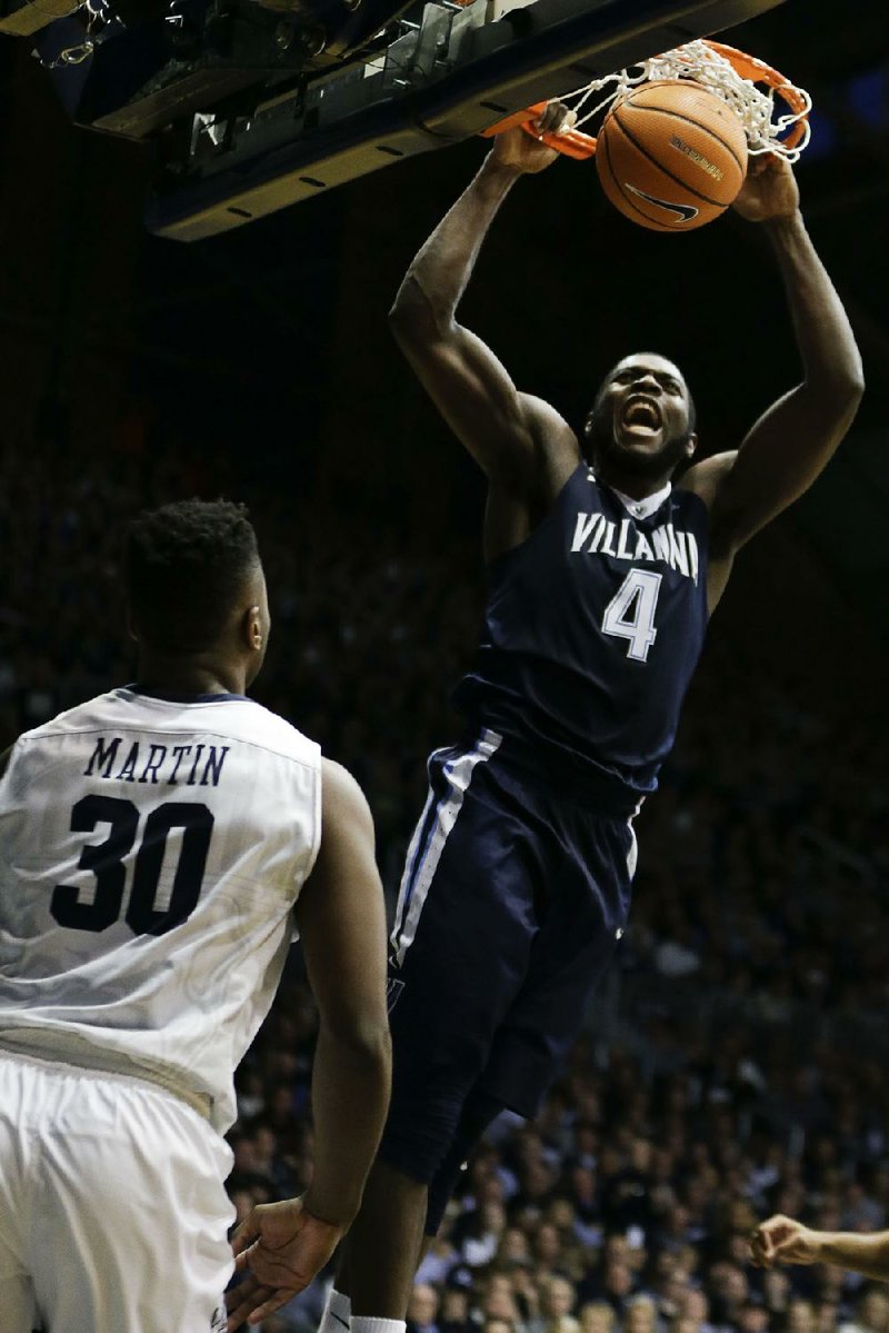 Villanova forward Eric Paschall (4) dunks in front of Butler forward Kelan Martin (30) in the second half of the No. 1-ranked Wildcats’ 101-93 loss to the Bulldogs. Martin scored 24 points for Butler in the victory.