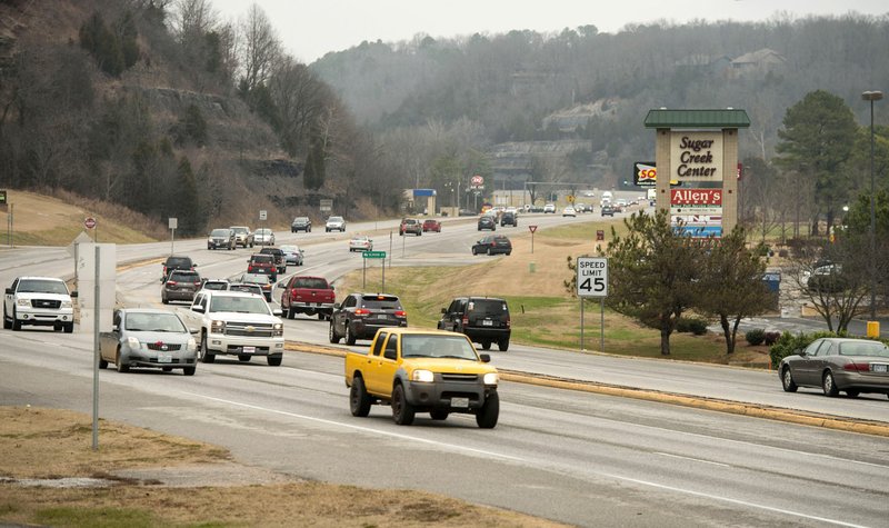 NWA Democrat-Gazette/BEN GOFF  @NWABENGOFF Traffic flows Dec. 20 on Bella Vista Way/U.S. 71 in Bella Vista. A new study says intersection improvements, added lanes and access controls such as traffic signals are needed to relieve rush-hour traffic.