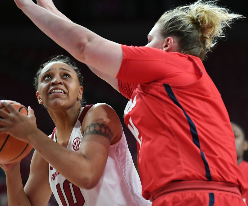 Arkansas' Kiara Williams looks to shoot while Ole Miss' Shelby Gibson defends Sunday Dec. 31, 2017 at Bud Walton Arena in Fayetteville. Arkansas won 73-72 and plays again at home on Jan. 7 against Alabama.