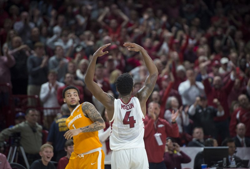 Arkansas Razorbacks guard Daryl Macon (4) waves out to the fans during a basketball game on Saturday, December 30, 2017 at Walton Arena in Fayetteville.