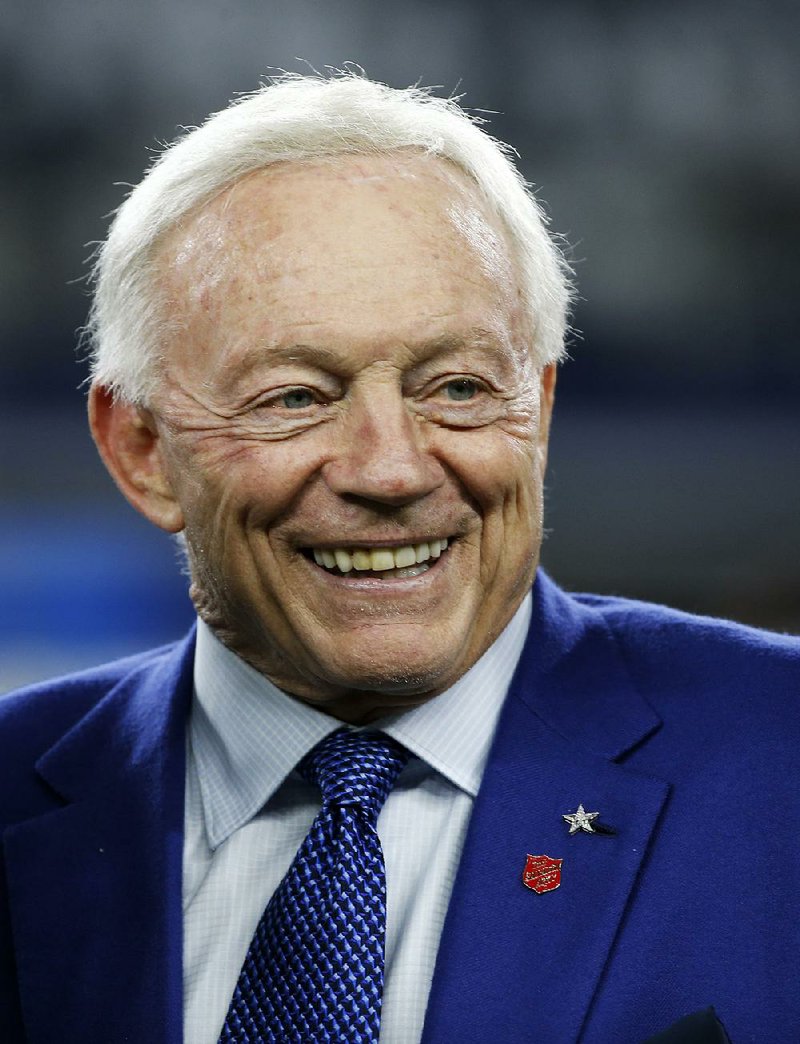 This Nov. 30, 2017, file photo shows Dallas Cowboys team owner Jerry Jones talking with others on the field during team warmups before an NFL football game in Arlington, Texas. 