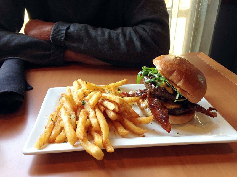 Copper Grill’s Signature Sweet Hot Burger comes with thick “millionaire’s bacon,” bacon jam, pimento cheese, arugula and sriracha.