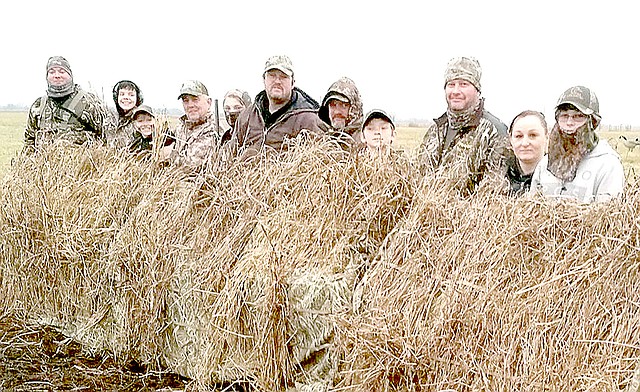 Photo Submitted Hunter Keith, Bryan Lewis, Jake O'Brien and Isaiah Roosa, along with parents and guides from Southern Flight Outdoors, spend the morning in a duck blind they helped build as part of the Young Outdoorsmen United two-day duck hunting workshop.