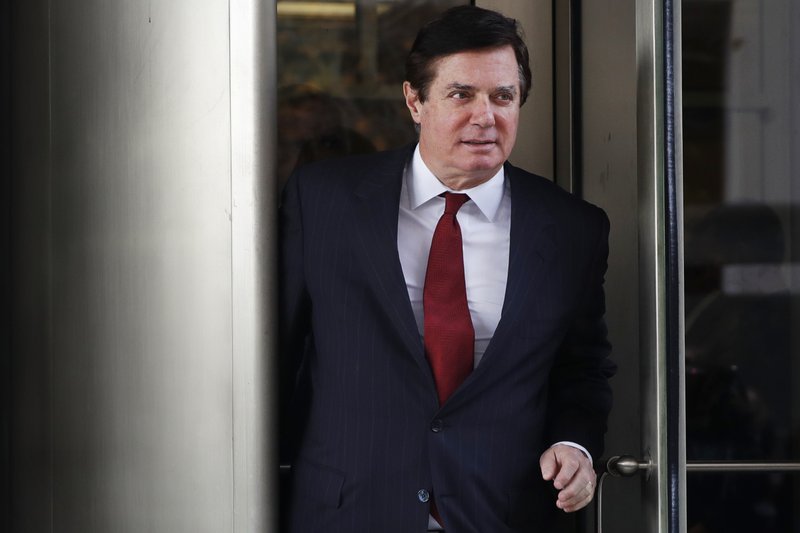 In this Nov. 6, 2017 photo, Paul Manafort, President Donald Trump's former campaign chairman, leaves the federal courthouse in Washington. Manafort has sued special counsel Robert Mueller saying he exceeded authority in the Russia probe. (AP Photo/Jacquelyn Martin)