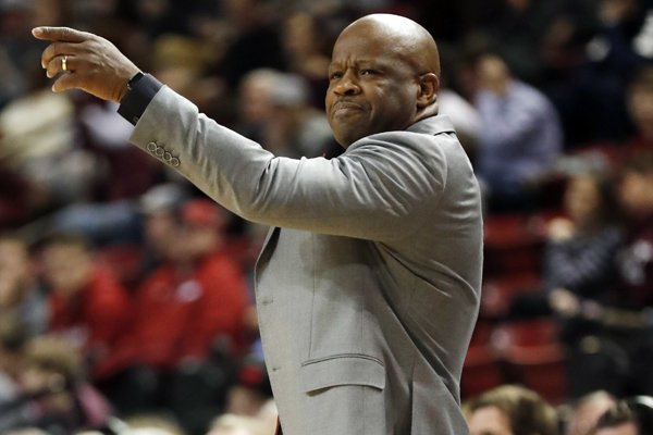 Arkansas head coach Mike Anderson gestures to his team during the first half of their NCAA college basketball game against Mississippi State in Starkville, Miss., Tuesday, Jan. 2, 2018. (AP Photo by Rogelio V. Solis)

