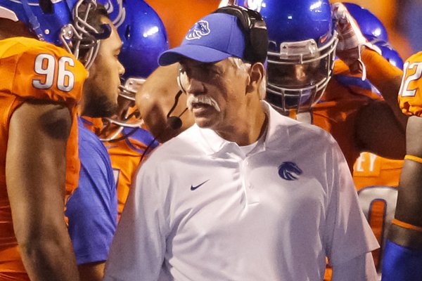 Boise State defensive line coach Steve Caldwell talks with his players during the second half of an NCAA college football game against Fresno State in Boise, Idaho, on Friday, Oct. 17, 2014. Boise State won 37-27. (AP Photo/Otto Kitsinger)

