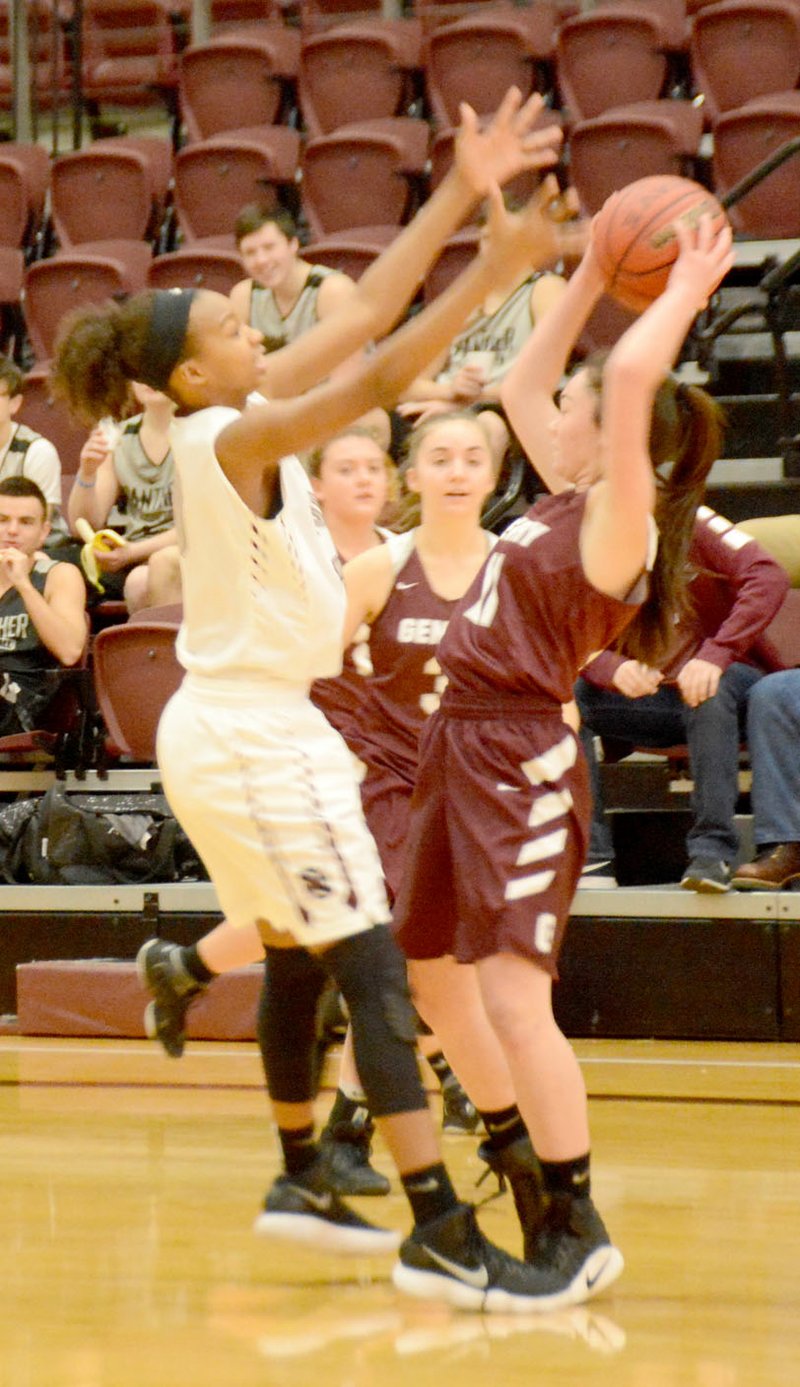 Siloam Springs sophomore Jael Harried ties up Gentry's Ahrya Reding during the first quarter of Saturday's seventh-place game in the Siloam Springs Holiday Classic. 