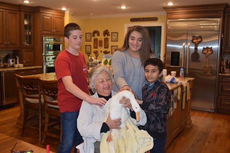 Eighth-grade science students in Armorel built a 3-D prosthetic leg for Peg, an 8-month-old Indian runner duck, shown with its owner, Patsy Smith. 