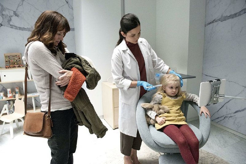 Rosemarie DeWitt (left) and Aniya Hodge (seated) appear in an episode of Black Mirror, directed by Jodie Foster. The fourth season is streaming on Netflix.