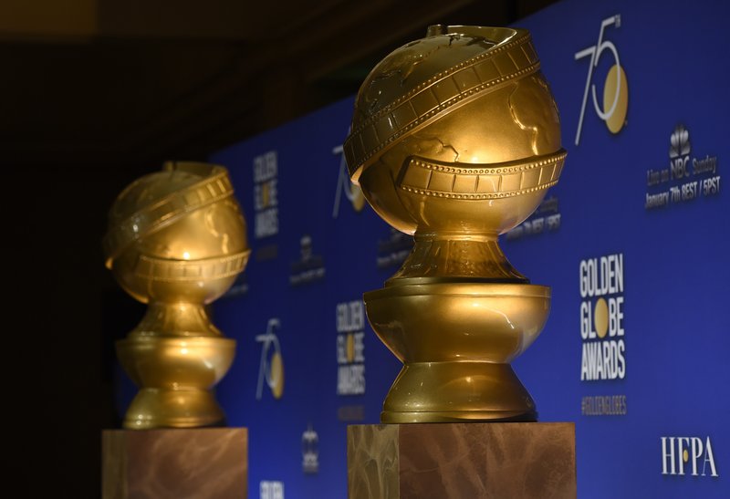 FILE - In this Monday, Dec. 11, 2017 file photo, Golden Globe statues appear on stage prior to the nominations for 75th Annual Golden Globe Awards at the Beverly Hilton hotel in Beverly Hills, Calif. The Golden Globe Awards, to be presented on Sunday night, Jan. 7, 2018, will be the most prominent display yet for the "MeToo" movement that has swept through Hollywood and left a trail of disgraced men in its wake. What has long been a star-studded primetime party may this Sunday take on the tenor of a protest rally. (Photo by Chris Pizzello/Invision/AP, File)