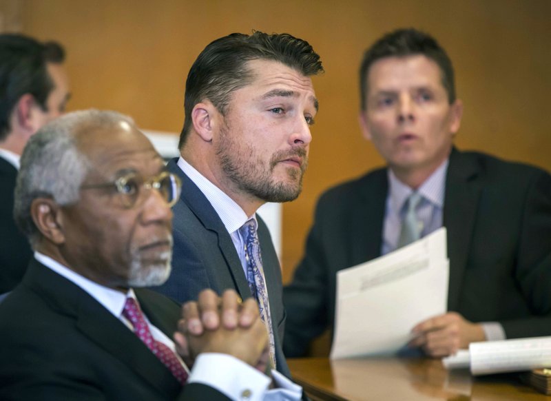 FILE - In this Nov. 27, 2017, file photo, Iowa farmer and former TV reality show celebrity Chris Soules listens during a hearing in Buchanan County District Court in Independence, Iowa. Soules is fighting to avoid prison after driving his pickup into the back of a tractor and killing a neighbor in April 2017. He lost a legal battle Friday, Jan. 5, 2018, in the felony case against him when a judge dismissed his constitutional challenge to an Iowa law requiring the surviving driver in a fatal accident to remain at the scene until police arrive. It goes beyond the statutes of many states. His trial is set for Jan. 18. (Rodney White/The Des Moines Register via AP, Pool, File)