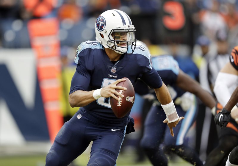FILE - In this Nov. 12, 2017, file photo, Tennessee Titans quarterback Marcus Mariota (8) plays against the Cincinnati Bengals in the second half of an NFL football game, in Nashville, Tenn. The Titans take on the Kansas City Chiefs in a wild-card playoff game on Saturday, Jan. 6, 2018 in Kansas City. (AP Photo/James Kenney, File)