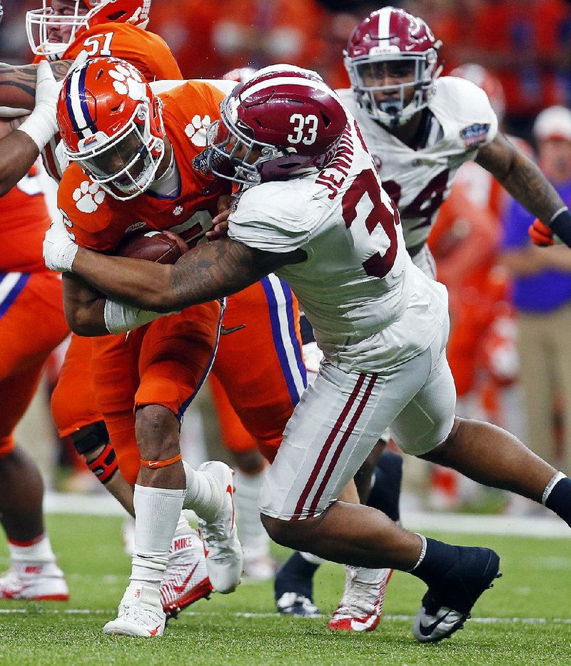 Clemson quarterback Kelly Bryant (2) is brought down by Alabama linebacker Anfernee Jennings (33) in the second half of the Sugar Bowl on Monday in New Orleans. Both Alabama and Georgia bring top-10 defenses into the College Football Playoff national championship game.