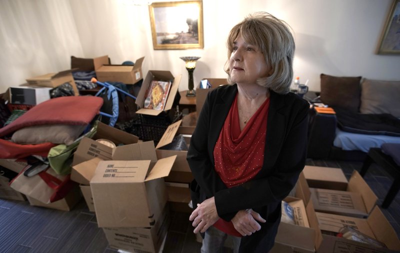 The Associated Press HOUSTON RECOVERY: Deb Eberhart stands in her living room full of boxes Friday in Houston. Eberhart, who recently returned to her remodeled home, had to evacuate during Hurricane Harvey as floodwaters filled her neighborhood. A group of psychologists has offered free counseling sessions to people working to recover from Harvey. Eberhart sought out the counseling sessions after realizing that the stress from the whole situation had left her frequently in tears and grinding her jaw.