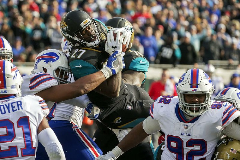 Jacksonville running back Leonard Fournette (27) is stopped by the Buffalo defense in the third quarter of the Jaguars’ 10-3 victory over the Bills. Jacksonville quarterback Blake Bortles threw a touchdown pass to Ben Koyack for the game’s only touchdown.