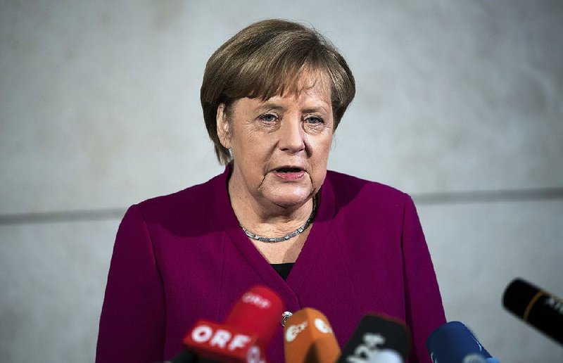 German chancellor Angela Merkel delivers a statement in Berlin, Sunday, Jan. 7, 2018. German Chancellor Angela Merkel embarked Sunday on talks with the center-left Social Democrats on forming a new government, with leaders stressing the need for speed as they attempt to break an impasse more than three months after the country's election. 