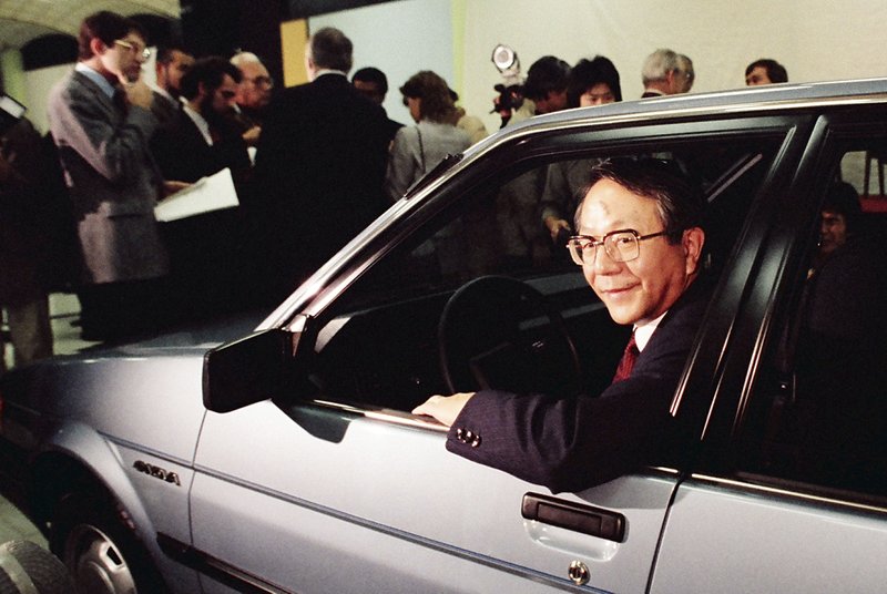 FILE - In this Tuesday, Dec. 18, 1984, file photo, United Motor Manufacturing Co. President Tatsuro Toyoda gets in the drivers seat of the newly unveiled sporty 4-door subcompact &quot;Nova&quot; in the new Fremont, Calif., United Motor Manufacturing Co. plantjointly jowned by General Motors and Toyota. Toyoda, a former president of Toyota Motor Corp., who led its climb to rank among the world&#x2019;s top automakers, and the son of the Japanese automaker&#x2019;s founder, has died. He was 88. (Toyota Motor Corp. via AP)(AP Photo/Paul Sakuma)