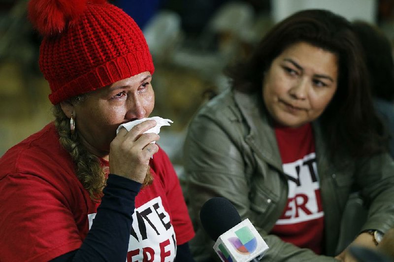 Salvadoran immigrant Diana Paredes (left) reacts after Trump’s announcement on Temporary Protected Status for nationals of El Salvador on Monday in Los Angeles.