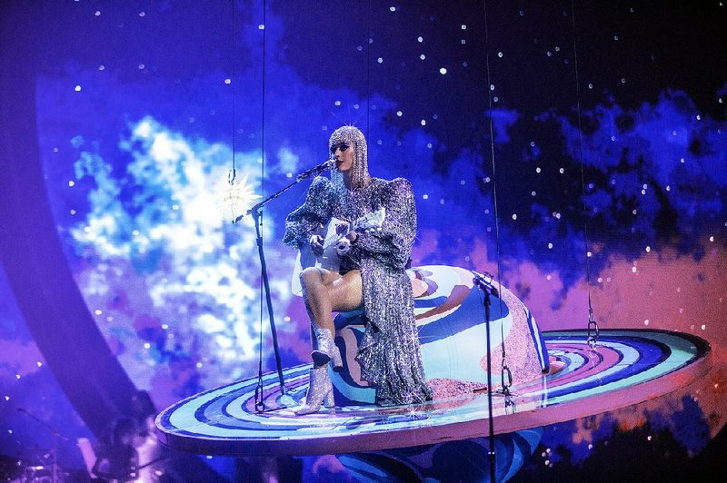 Pop superstar Katy Perry takes a spin atop Saturn during her latest tour, which stops at Verizon Arena in North Little Rock on Friday.