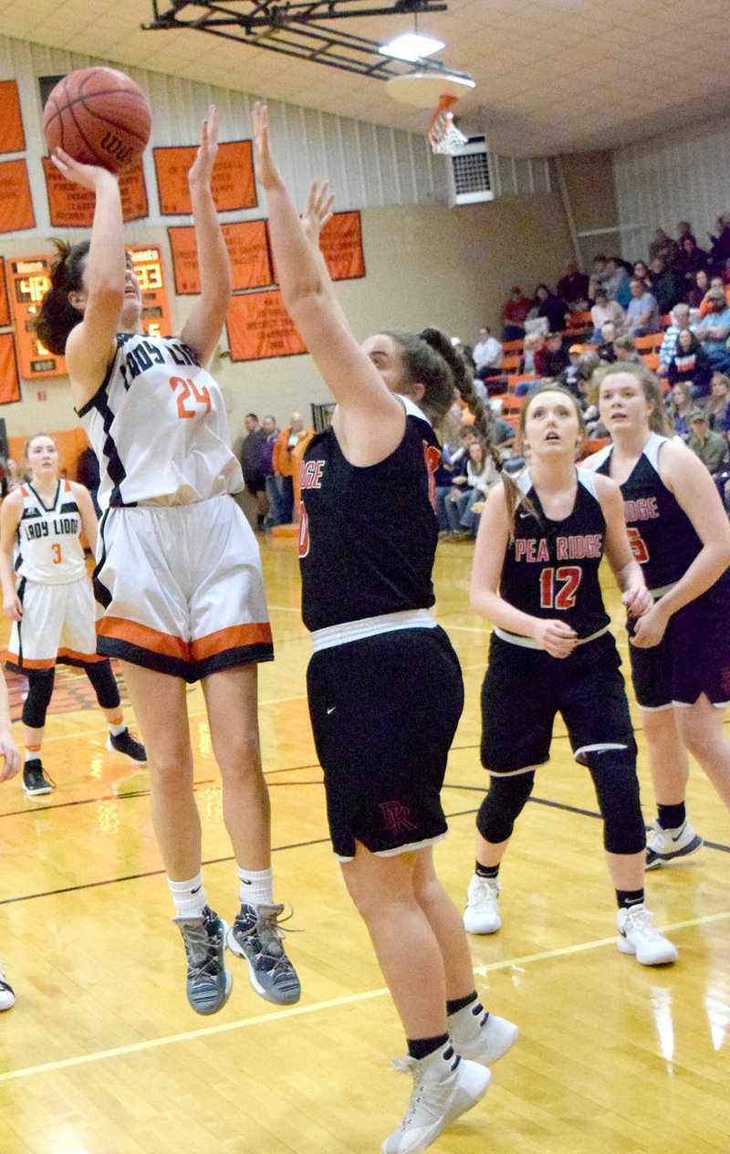 Westside Eagle Observer/MIKE ECKELS Cally Kildow (Lady Lions 24) puts up a jumper during the third quarter of the Gravette-Pea Ridge senior girls' basketball contest at the Competition Gym in Gravette Jan 6. Kildow had 21 points to lead the Lady Lions to a 67-42 win over the Lady Blackhawks.
