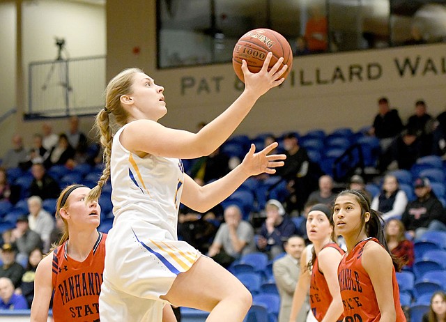 Bud Sullins/Special to the Herald-Leader John Brown senior Luize Skrastina drives to the basket Saturday against Panhandle State.