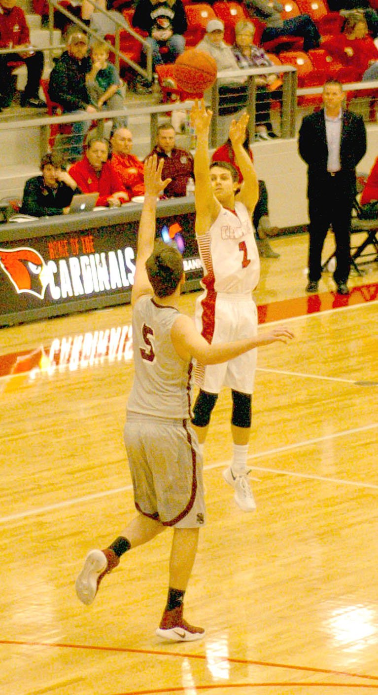 Mark Humphrey/Enterprise-Leader Uncovered by the Siloam Springs defense, Farmington senior Matt Wilson launches a deep 3-pointer on his way to a school-record 49 points during a Jan. 3 contest won by the Cardinals, 70-48. Wilson made five 3-point shots all in the first half.