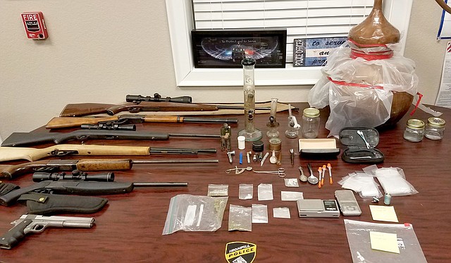 SUBMITTED Highfill Police Department shows items siezed in a Jan. 5 drug arrest from the home of Jason and Kimberly Vanhook.