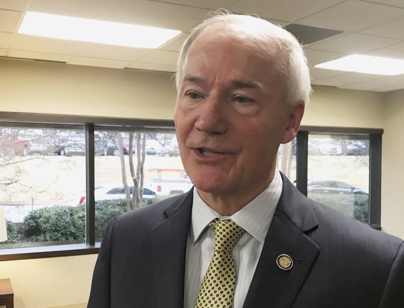 Arkansas Gov. Asa Hutchinson speaks to reporters in Little Rock, Ark. on Tuesday, Jan. 9, 2018, about his proposed budget for the coming fiscal year. The Republican governor is proposing a $5.6 billion budget that increases spending on Medicaid and sets aside surplus money for future tax cuts and highway needs. (AP Photo/Andrew DeMillo)