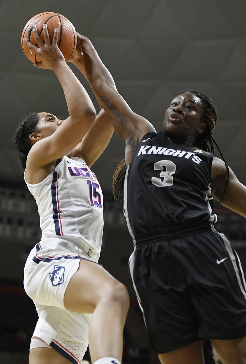 Central Florida's Zakiya Saunders, right, blocks a shot by Connecticut's Gabby Williams, left, during the first half an NCAA college basketball game, Tuesday, Jan. 9, 2018, in Storrs, Conn. (AP Photo/Jessica Hill)