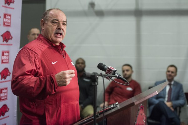 Arkansas defensive coordinator John Chavis speaks during a news conference Wednesday, Jan. 10, 2018, in Fayetteville. Arkansas head coach Chad Morris can be seen in the background on the far right. 