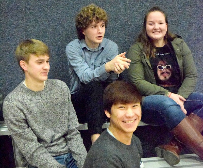 Ryan Shaffer (top, center) watches some of his former Decatur Bulldog basketball/track teammates play their final game of 2017 against the Life Way Warriors in the gym at First Baptist Church in Centerton Dec. 29. Joining Shaffer was his sister Cameron (top, right) and friends Bracy Owens (left) and Leng Lee, the old guard.