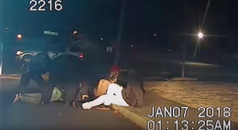 This screenshot from a North Little Rock Police Department video shows officers struggling with a teen gunman before he was fatally shot. 